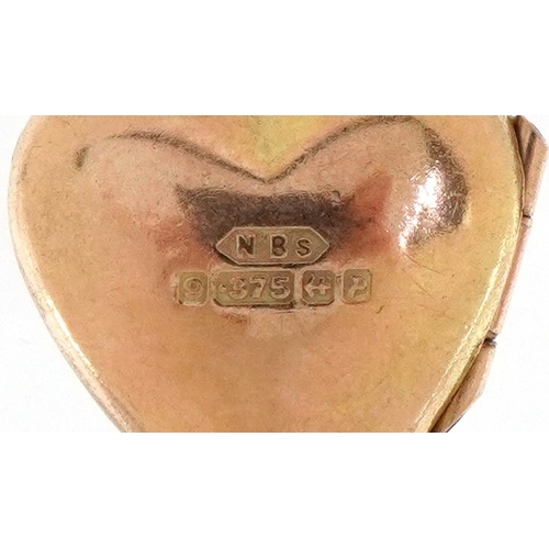 2375 - 9ct gold floral engraved love heart locket, 1.5cm high, 1.5g