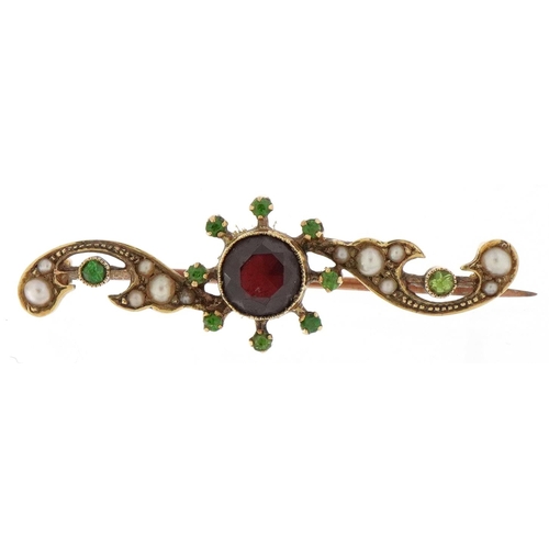 2077 - Unmarked gold garnet, seed pearl and green stone bar brooch, 4cm wide, 3.2g