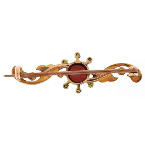 2077 - Unmarked gold garnet, seed pearl and green stone bar brooch, 4cm wide, 3.2g