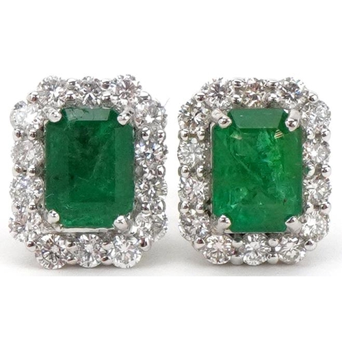 2250 - Pair of 18ct white gold emerald and diamond stud earrings, total diamond weight approximately 0.70 c... 