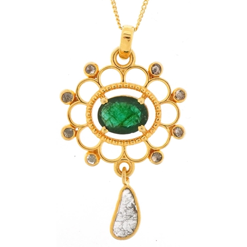 2411 - Yellow metal emerald and diamond openwork pendant on a silver gilt necklace, total diamond weight ap... 