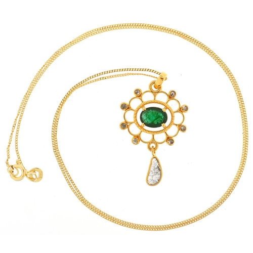 2411 - Yellow metal emerald and diamond openwork pendant on a silver gilt necklace, total diamond weight ap... 