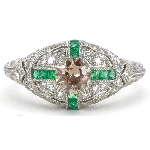 2200 - Art Deco style platinum champagne diamond, white diamond and emerald cluster ring, the central diamo... 