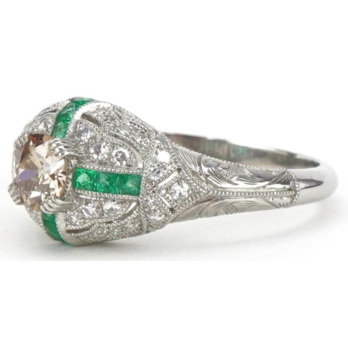 2200 - Art Deco style platinum champagne diamond, white diamond and emerald cluster ring, the central diamo... 