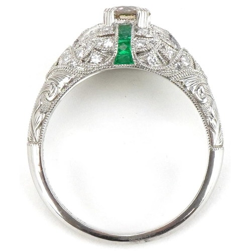 2200 - Art Deco style platinum champagne diamond, white diamond and emerald cluster ring, the central diamo... 