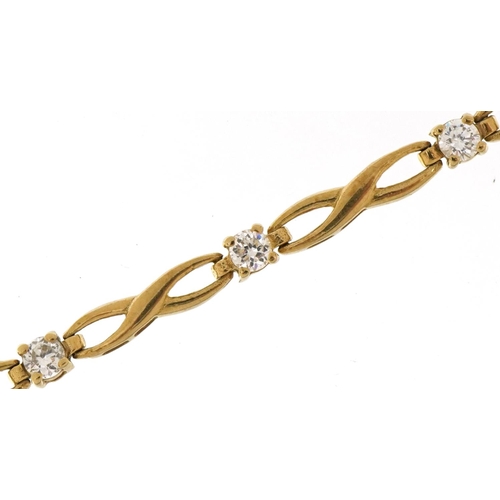 2383 - 9ct gold clear stone infinity link bracelet, 18cm in length, 4.9g