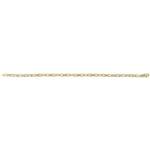 2383 - 9ct gold clear stone infinity link bracelet, 18cm in length, 4.9g