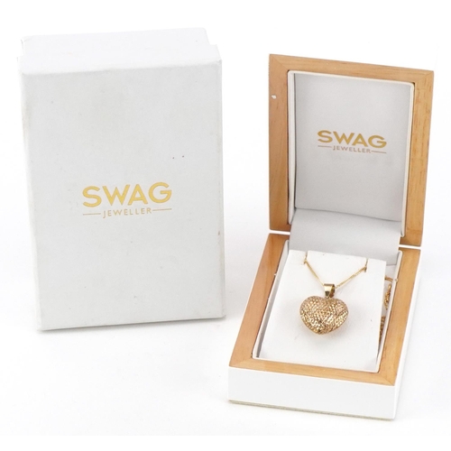 2696 - 9ct gold love heart locket on a 9ct gold necklace housed in a Swag jeweller's box, 2.5cm high and 44... 