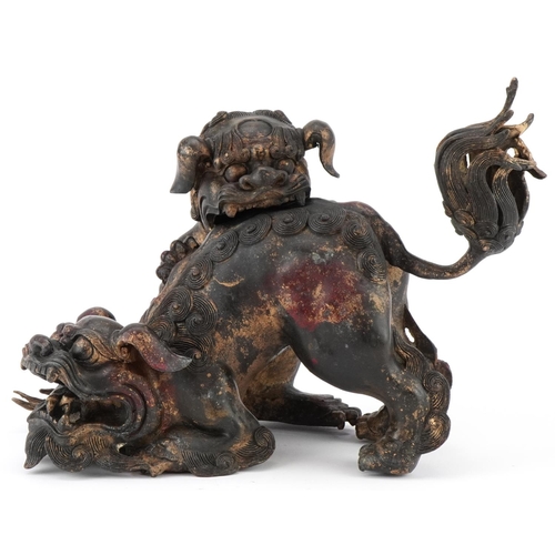 1429 - Chinese partially gilt bronze incense burner in the form of two Qulin's, 30cm in length