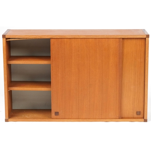 1053 - Beaver & Tapley, mid century Scandinavian design teak modular wall cupboard with a pair of sliding d... 