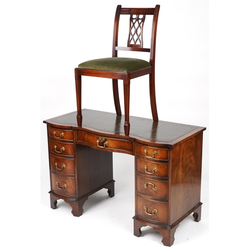 1012 - Mahogany serpentine front twin pedestal desk and a mahogany chair, the desk with nine drawers and gr... 