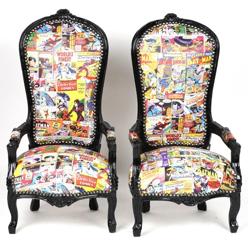 1013 - Pair of ebonised child's elbow chairs with comic upholstery, 100cm high