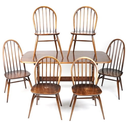 1027 - Ercol elm dining table and six stick back chairs, the table 72cm H x 152cm W x 76cm D