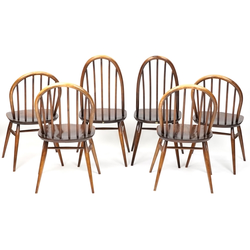 1027 - Ercol elm dining table and six stick back chairs, the table 72cm H x 152cm W x 76cm D