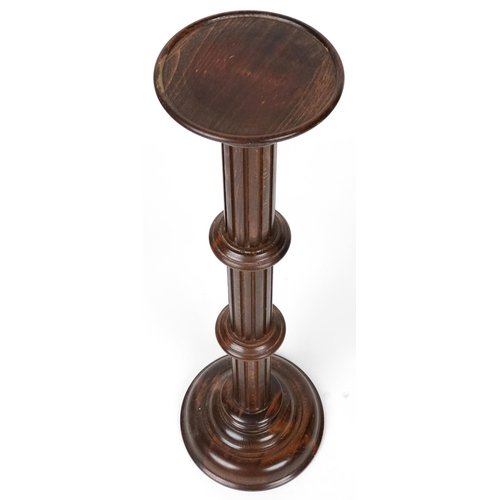 1090 - Carved oak torchere, 98cm high