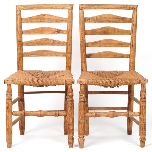 1116 - Pair of beech ladderback chairs with cane seats, each 93cm high