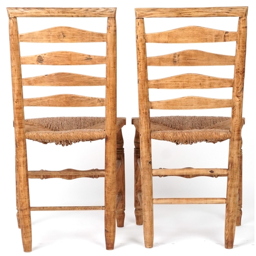 1116 - Pair of beech ladderback chairs with cane seats, each 93cm high