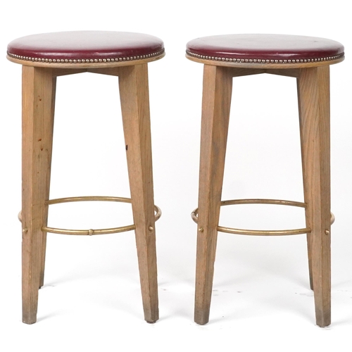 1070 - Pair of contemporary breakfast bar stools with burgundy leather upholstered padded seats, each 72cm ... 