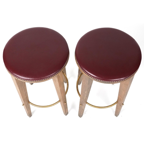 1071 - Pair of contemporary breakfast bar stools with burgundy leather upholstered padded seats, each 72cm ... 