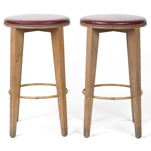 1071 - Pair of contemporary breakfast bar stools with burgundy leather upholstered padded seats, each 72cm ... 