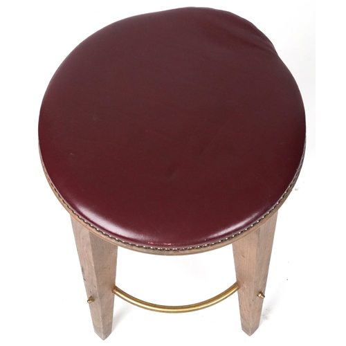 1099 - Contemporary breakfast bar stool with burgundy leather upholstered padded seat, 64cm high