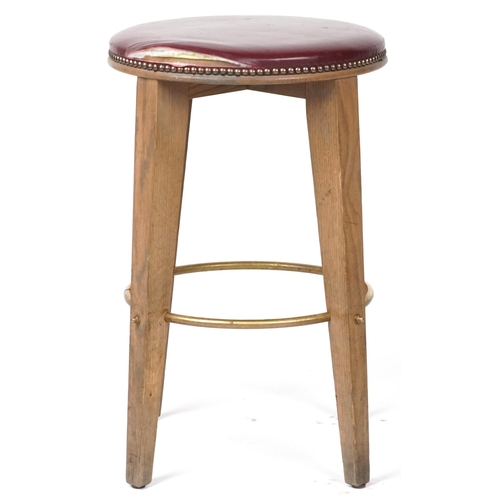 1099 - Contemporary breakfast bar stool with burgundy leather upholstered padded seat, 64cm high