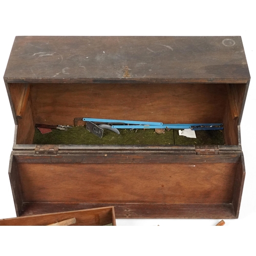 1061 - Antique and later  woodworking tools housed in a stained pine carpenter's box, 76cm wide