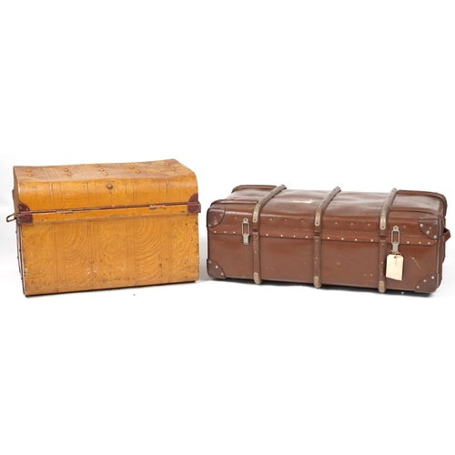 1121 - Two vintage travelling trunks including one tin example, the largest 95 cm in length