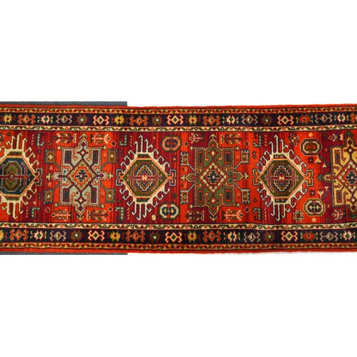 1125A - Rectangular Turkish carpet runner having and all over floral design 385cm x 69cm