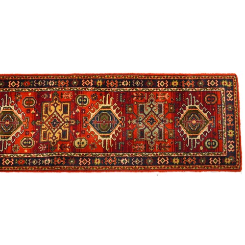 1125A - Rectangular Turkish carpet runner having and all over floral design 385cm x 69cm