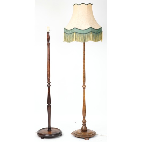 1112 - Two early 20th century turned standard lamps, one with silk lined shade, each 160cm high