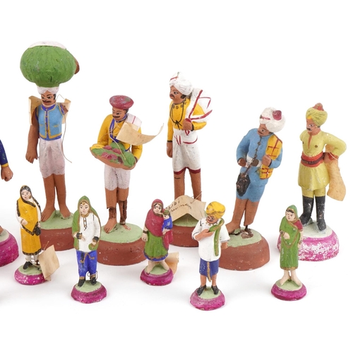 392 - Vintage Indian hand painted plaster figures including a tailor, postman, street seller tailor and gl... 