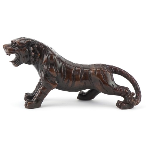 1330 - Japanese patinated bronze okimono of a tiger, 34cm in length