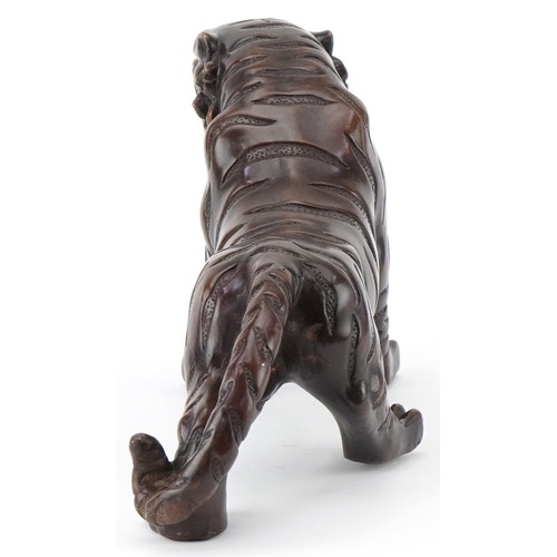 1330 - Japanese patinated bronze okimono of a tiger, 34cm in length