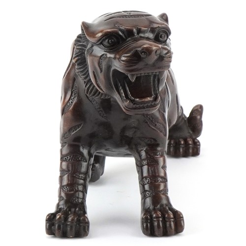 1330 - Japanese patinated bronze okimono of a tiger, 34cm in length