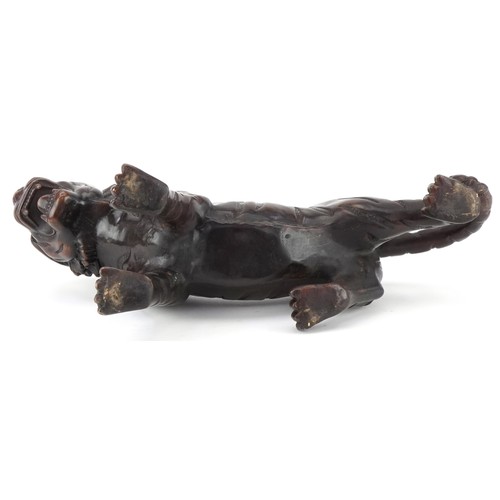 1330 - Japanese patinated bronze okimono of a tiger, 34cm in length