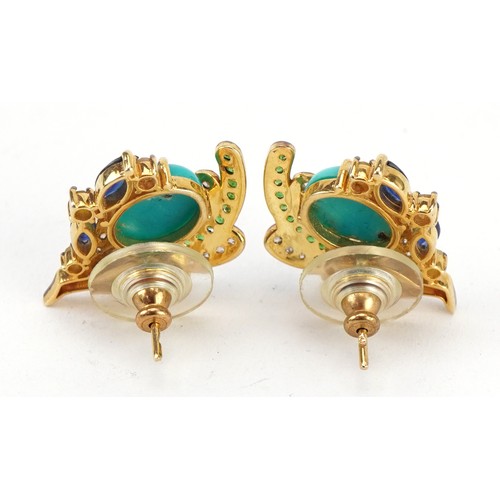 2031 - Pair of silver gilt bird of paradise stud earrings set with diamonds, emeralds, sapphires and caboch... 