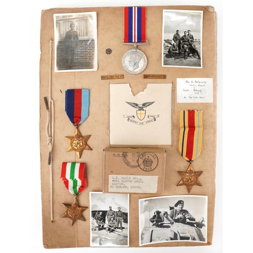British military World War II medals for E H Bayly of The Desert Air Force with a detailed account of journeys between the UK and Africa 1941-1946 along with photographs of him and his colleagues in the desert including tanks and aeroplanes and with his colleagues and pictures of Montgomery and Churchill