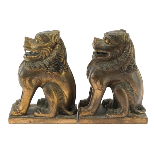 80 - Pair of heavy Oriental Buddhist bronze altar lions, each 18cm high