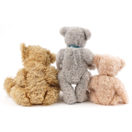 612 - Three large Martin collectable teddy bears with jointed limbs, the largest 56cm high