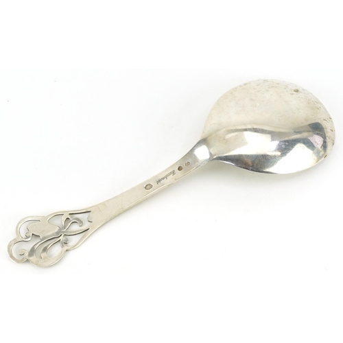 2442 - S A J Jacobsen, Danish silver spoon inscribed Haandsmedet, the terminal pierced with stylised flower... 