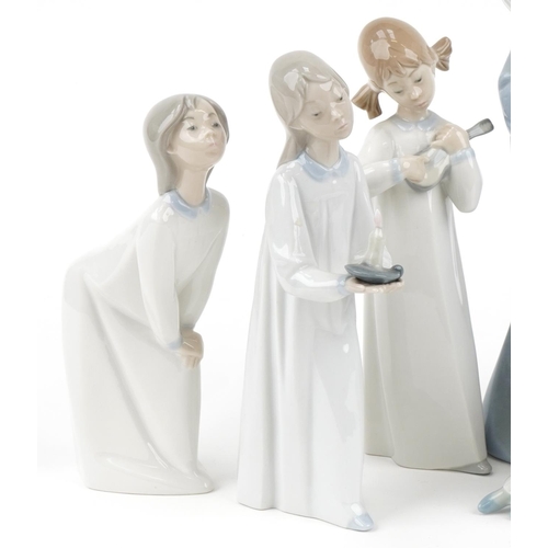 1051 - Ten Lladro and Nao porcelain figures, the largest 27cm high