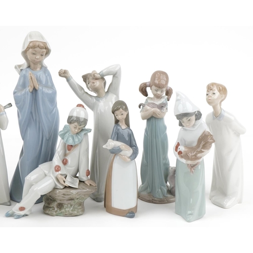 1051 - Ten Lladro and Nao porcelain figures, the largest 27cm high