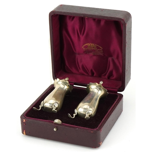 2452 - Charles S Green & Co Ltd, pair of George V silver casters housed in a Morris Bros jeweller's velvet ... 