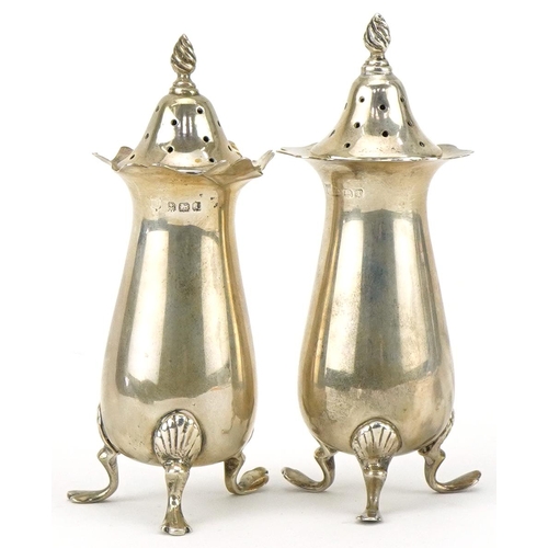 2452 - Charles S Green & Co Ltd, pair of George V silver casters housed in a Morris Bros jeweller's velvet ... 