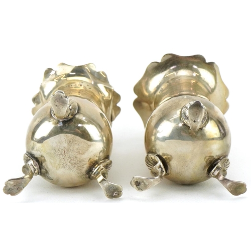 2452 - Charles S Green & Co Ltd, pair of George V silver casters housed in a Morris Bros jeweller's velvet ... 