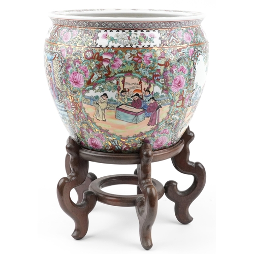 344 - Large Chinese porcelain fish bowl jardiniere hand painted with flowers and courtiers, on a hardwood ... 