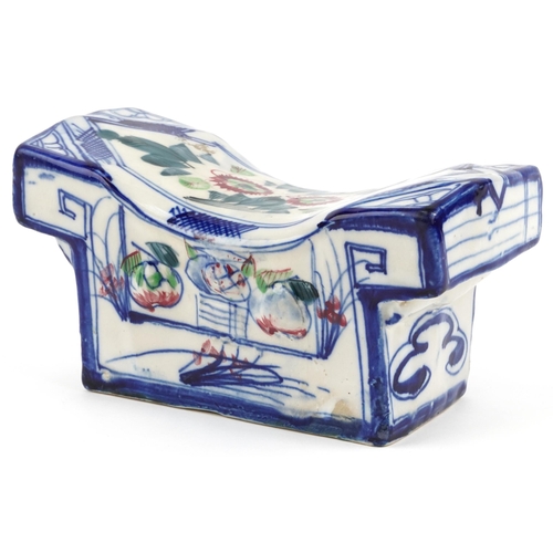 1134 - Chinese hand painted pottery headrest decorated with objects and flowers, 24cm  wide