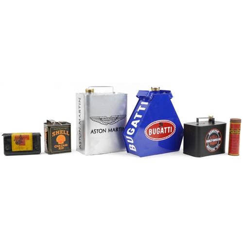 1180 - Four advertising fuel cans together with AA leather case with first aid kit and Dunlop repair kit