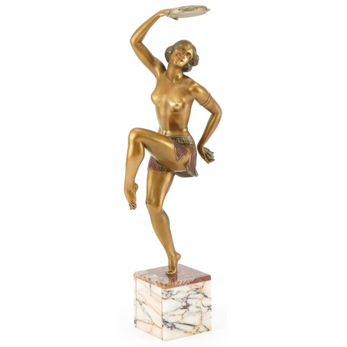Cold painted spelter figurine of an Art Deco tambourine player mounted on a marble base, 46cm high